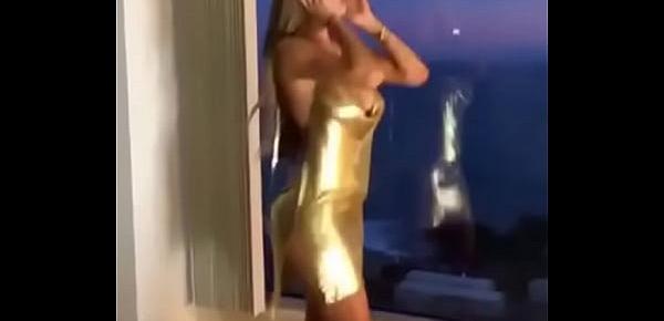  Sexy young girl is showing her sexy golden dress
